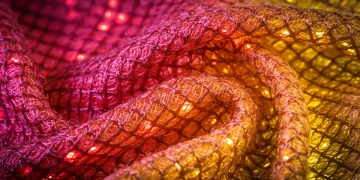 Futuristic textile with glowing fibers, representing advanced textile technology in fashion.